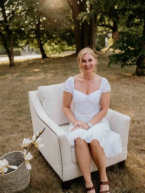 Rita, home stager in Chilliwack and co-founder of Pair Home Design, smiling in a styled living space.